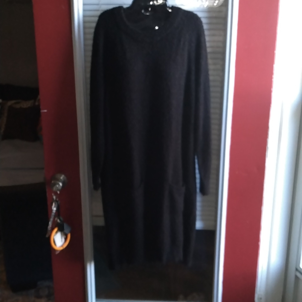 A long black sweater with pockets size large